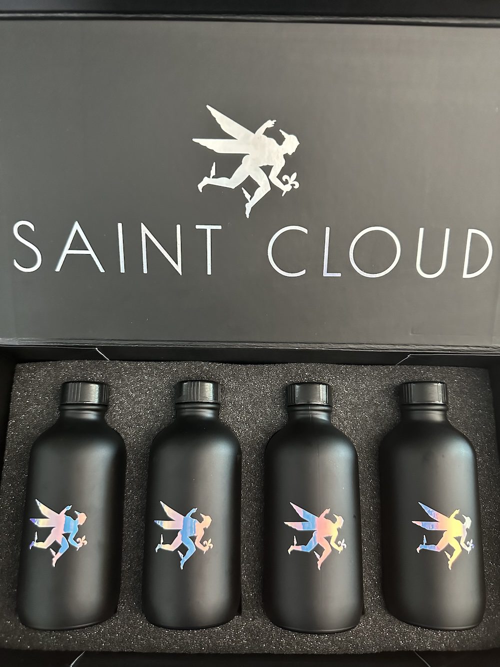 The open Designer kit with four black sample bottles