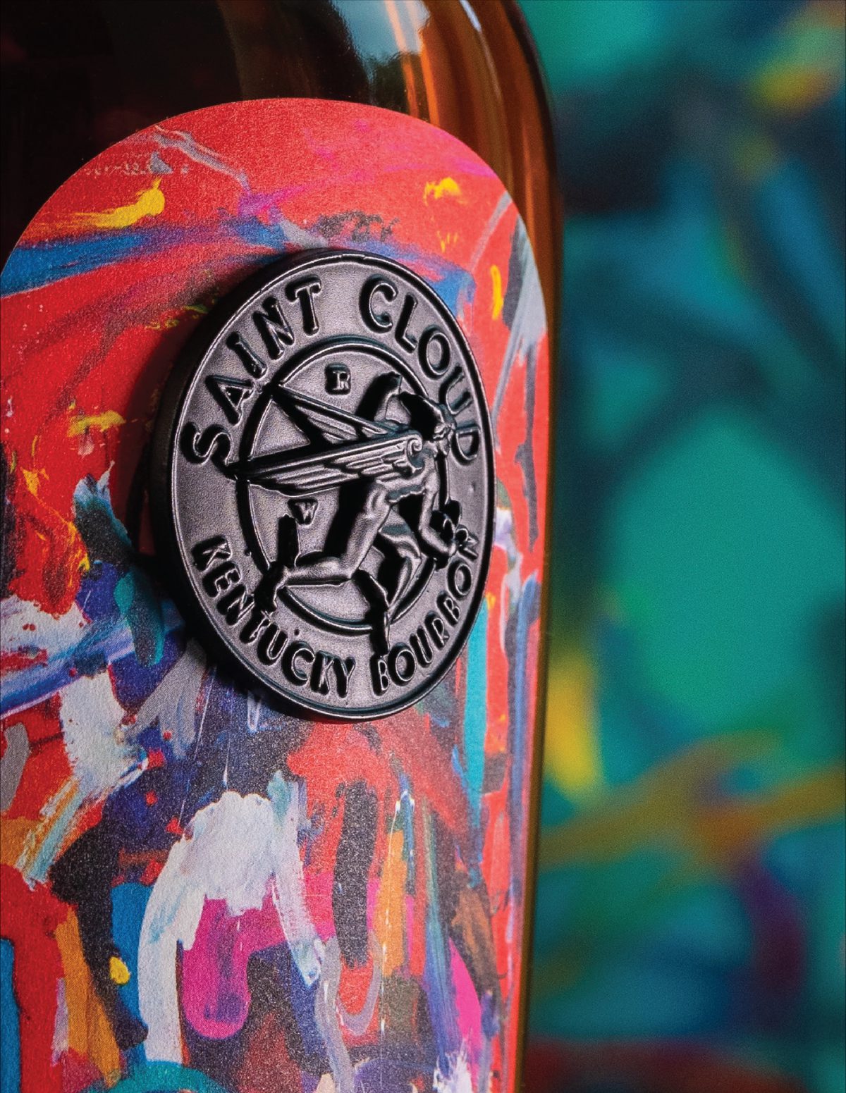 Close-up of an Abstrakt bottle with a hand-painted abstract label