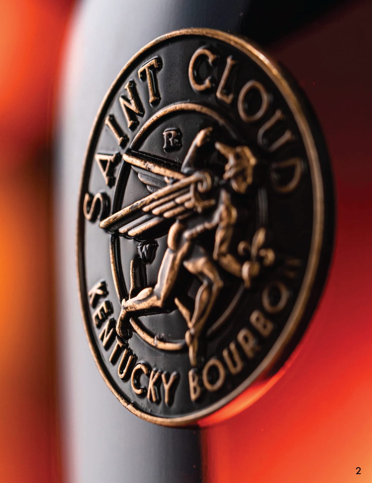 Close-up of the gold Saint Cloud medallion on the bottle