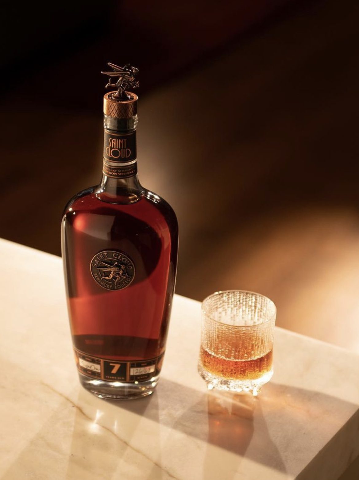 A bottle of Saint Cloud in window light